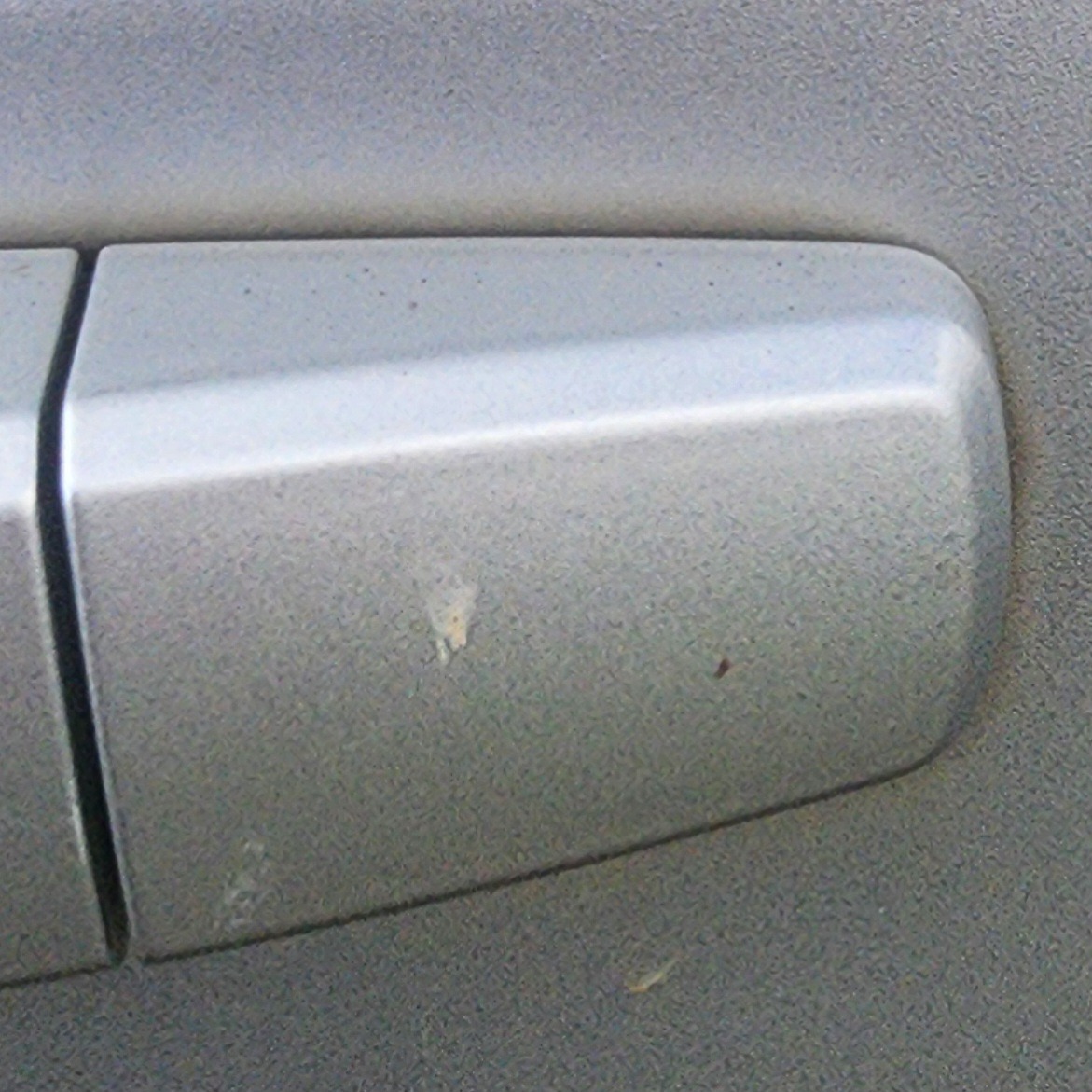 SONIC SEDAN LEFT FRONT HANDLE END PIECE